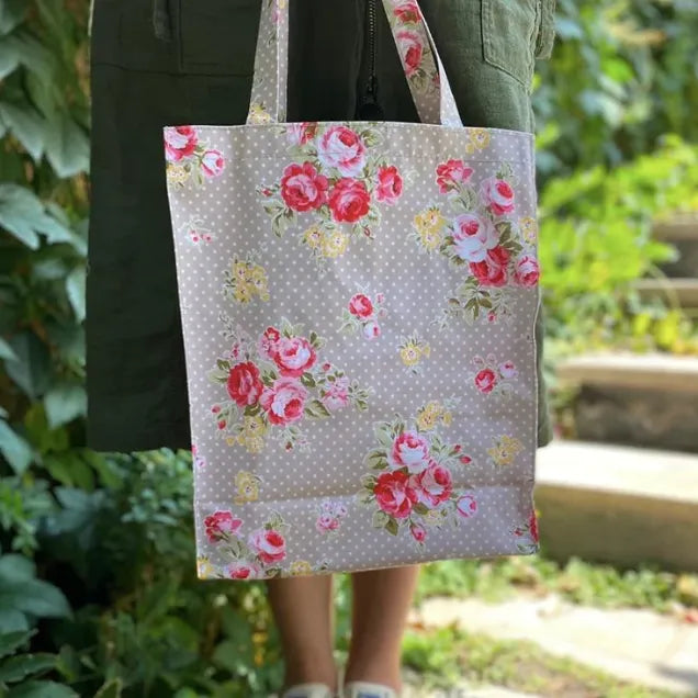Bolso largo de hule beige puntos y flores