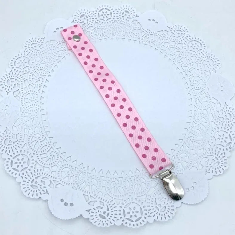 Porta chupetes rosados lunares