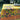 Mantel de género estampado borde amarillo flores