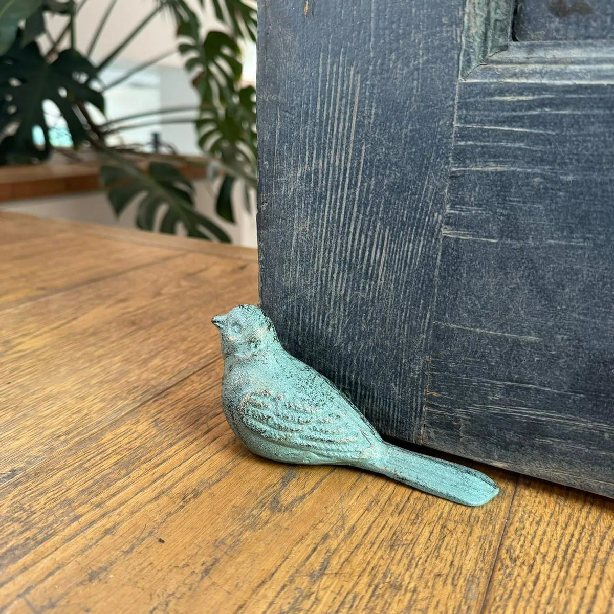 Sujeta puerta forma pájaro